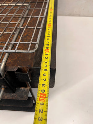 Compact Metal Wood-Burning Braai Stand with Grid — Significant Surface Rust and Heavy Wear – width measurement