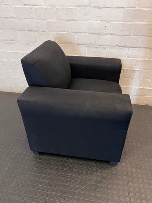 Black Synthetic Polyester 1 Seater Couch — Stains on Material; Intact Structure – back view