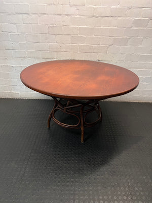 Round Wooden Dining Table with Rattan Style Base — Fair Condition with Visible Wear – main front view
