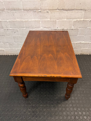 Classic Brown Wooden Coffee Table with Turned Legs — Fair Condition with Visible Wear – side view