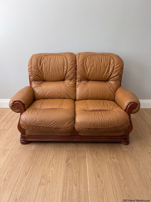 Tan Brown 2 Seater Couch with Carved Wooden Base — Good Condition – styled product image
