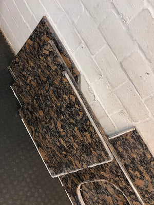 Polished Brown Mottled Stone Countertop with Sink Cutout – condition detail