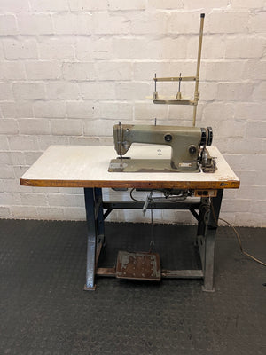 Industrial Sewing Machine on Workstation Table — Good Working Order – main front view