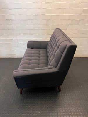 Grey Tufted Fabric 2 Seater Couch with Wooden Legs — Good with Minor Wear and Tear – side view