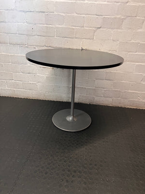 Round Black Table with Metallic Pedestal Base – side view