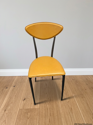 Yellow Upholstered Dining Chair with Tapered Metal Legs – styled product image