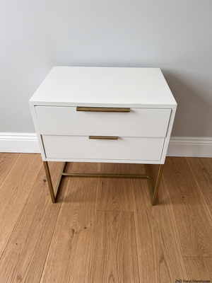 White Two-Drawer Bedside Table with Gold Metal Base – styled product image