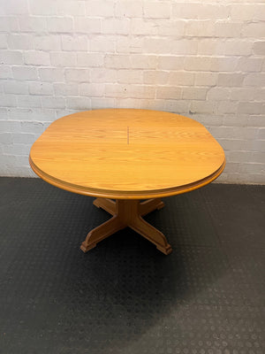 Round Wood-Finish Pedestal Dining Table – back view