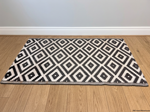 Black and White Geometric Diamond Area Rug – styled product image
