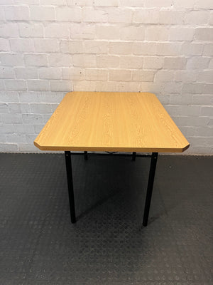 Oak Tone Dining Table with Black Metal Legs – back view