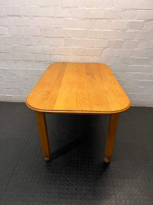Wooden Dining Table with Rounded Corners and Bun Feet — Well Used with Scratches and Fading on Seats