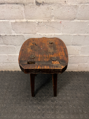 Rustic Hand-Carved Three-Legged Wooden Stool