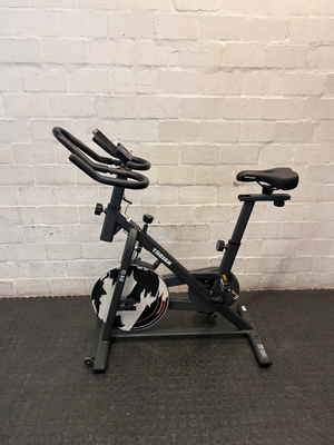 Trojan Spin 120 Exercise Bike in Dark Grey — Good Working Order; Missing Sticker on Wheel