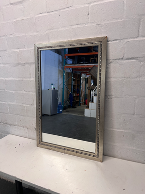 Rectangular Silver-Toned Mirror with Ornate Frame Detail