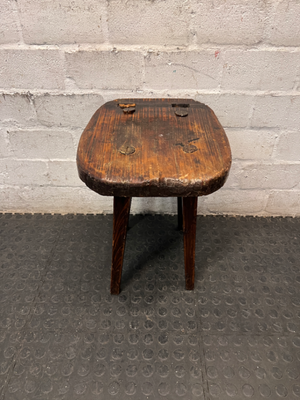 Rustic Hand-Carved Three-Legged Wooden Stool