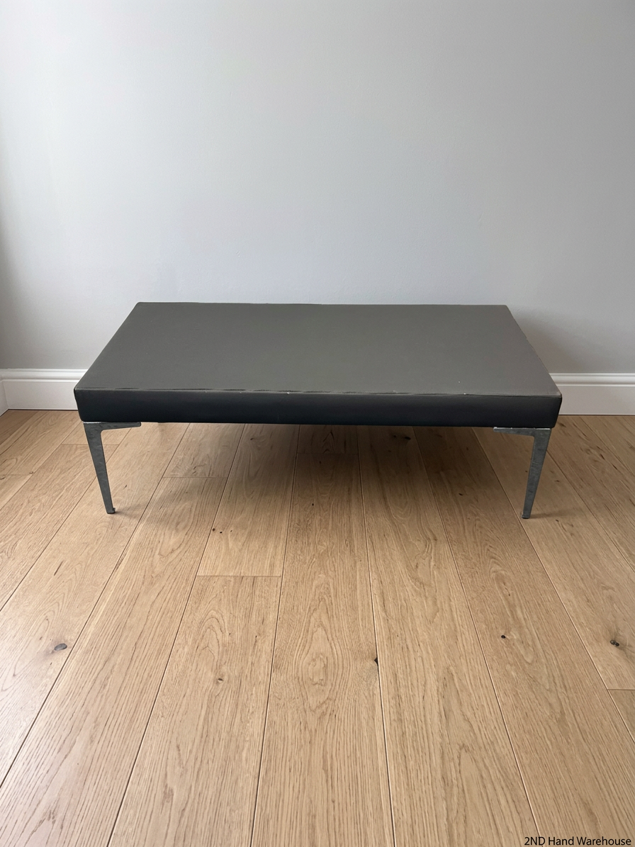 Black Upholstered Bench with Chrome Legs — Fair Condition with Visible Wear