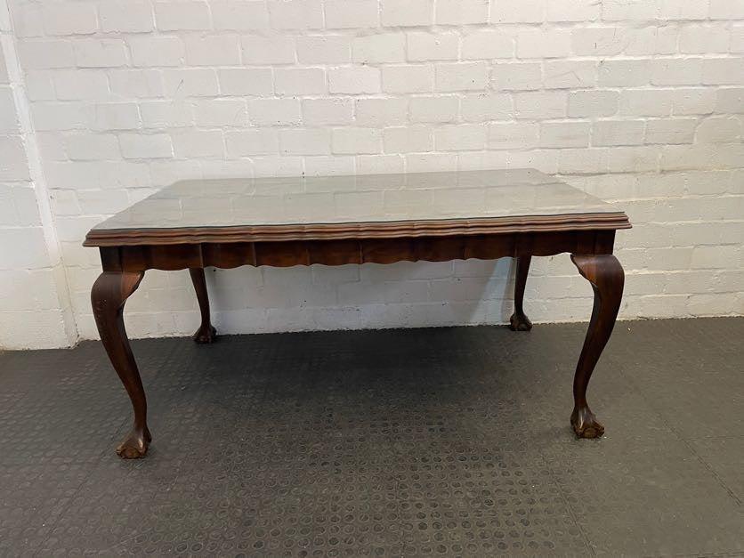 Dark Wood Beveled Edge Dining Table with Glass Top (Scratched)
