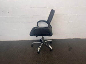 Black Plastic Mid-back Office Armchair on wheels