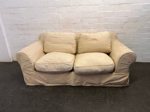 Cream Material Two Seater Couch (Tear in Material on Armrest) - REDUCED