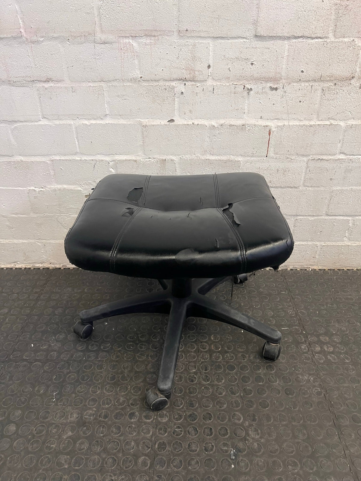 Black Office Footstool on Wheels (Torn Seat)
