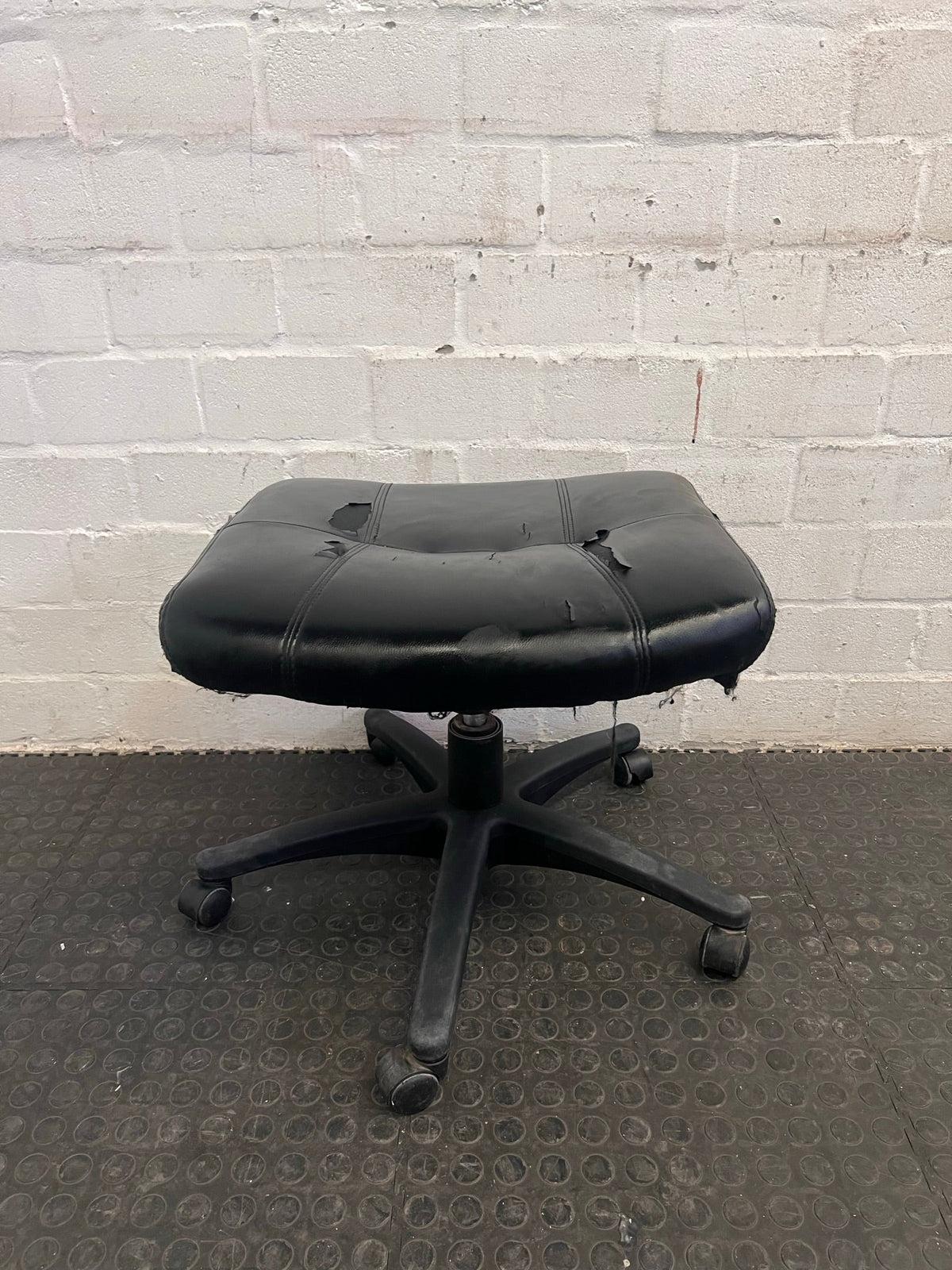 Black Office Footstool on Wheels (Torn Seat)