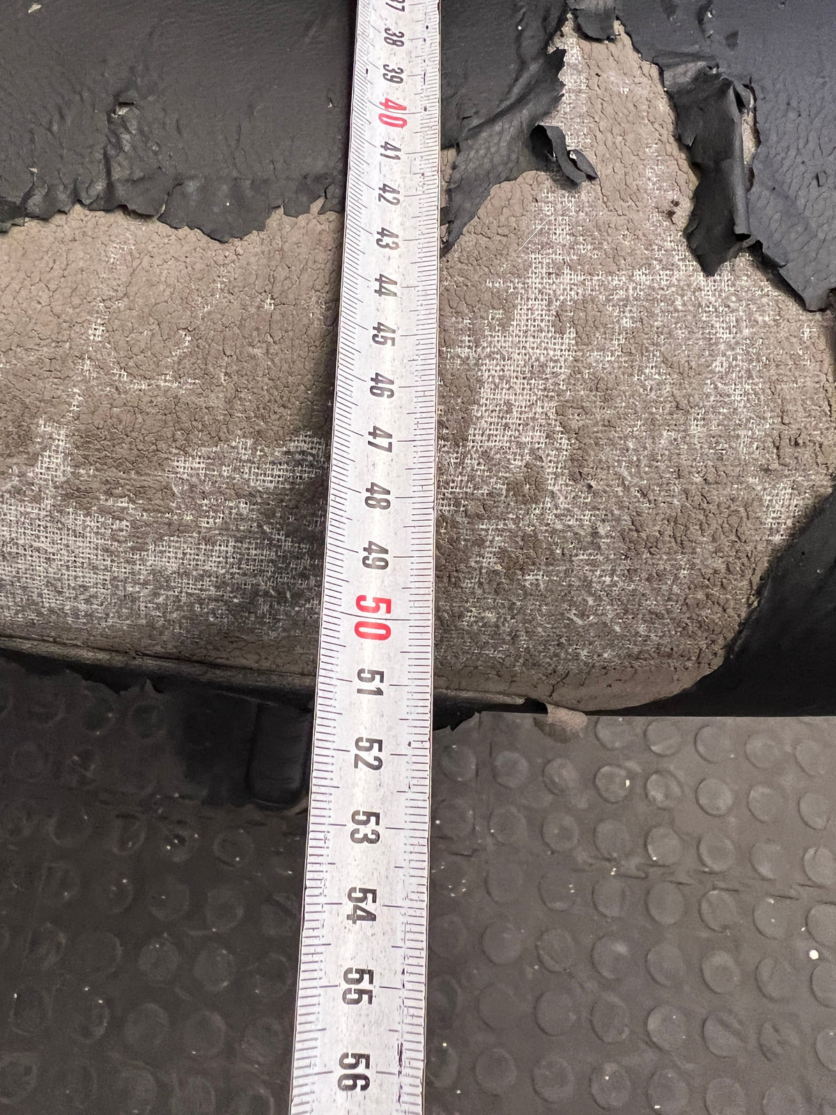 Black Padded Office Armchair on Wheels (Peeling Pleather)