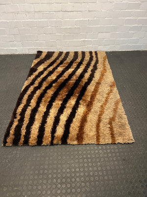 Light and dark brown rug 1.3m by 2.1m