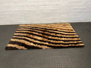 Light and dark brown rug 1.3m by 2.1m