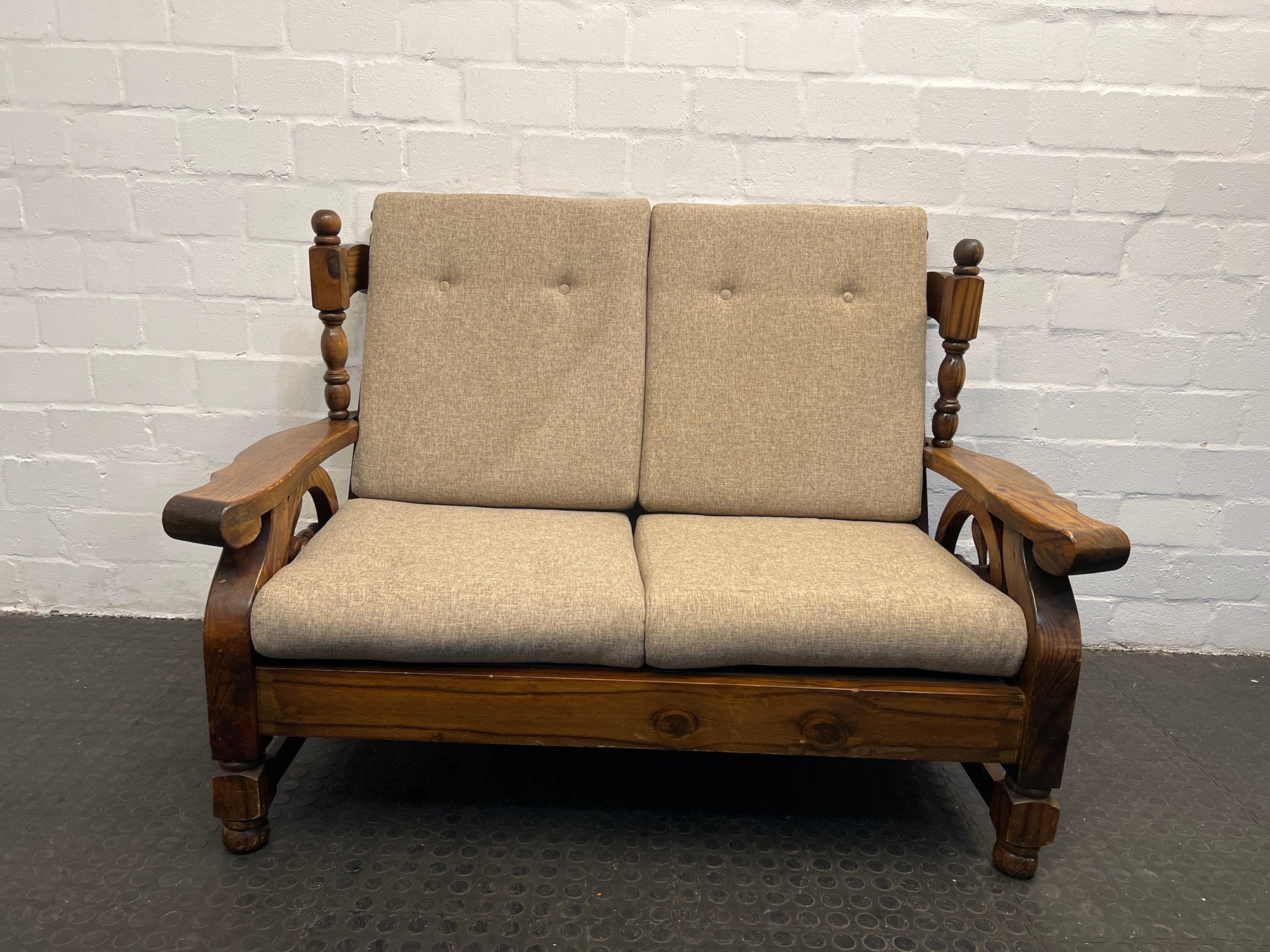 Wooden Framed Two Seater Couch with Tan Pillows