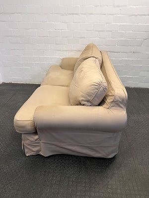 Beige Three Seater Couch with Slip Cover