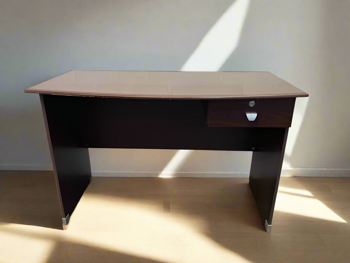 A dark brown wooden slim office desk with a modern design, featuring a drawer and a file compartment.