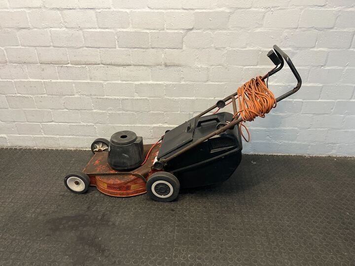 Mirage Electric Orange Lawnmower (Peeling Paint)