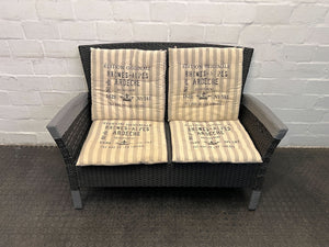 Dark Gray Woven Two Seater Patio Couch with Newspaper Patterned Cushions