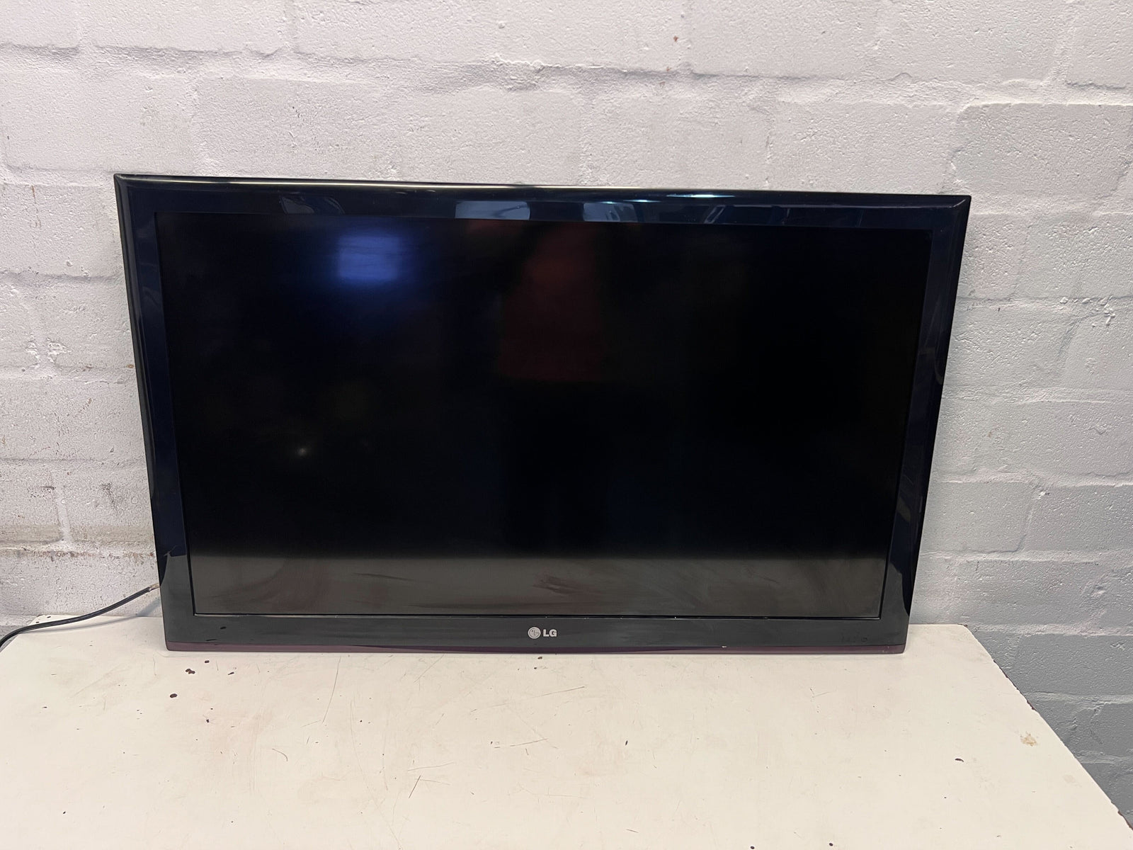 LG 42" HDTV - Sleek Black Frame, Minor Scratches, Tested & Working