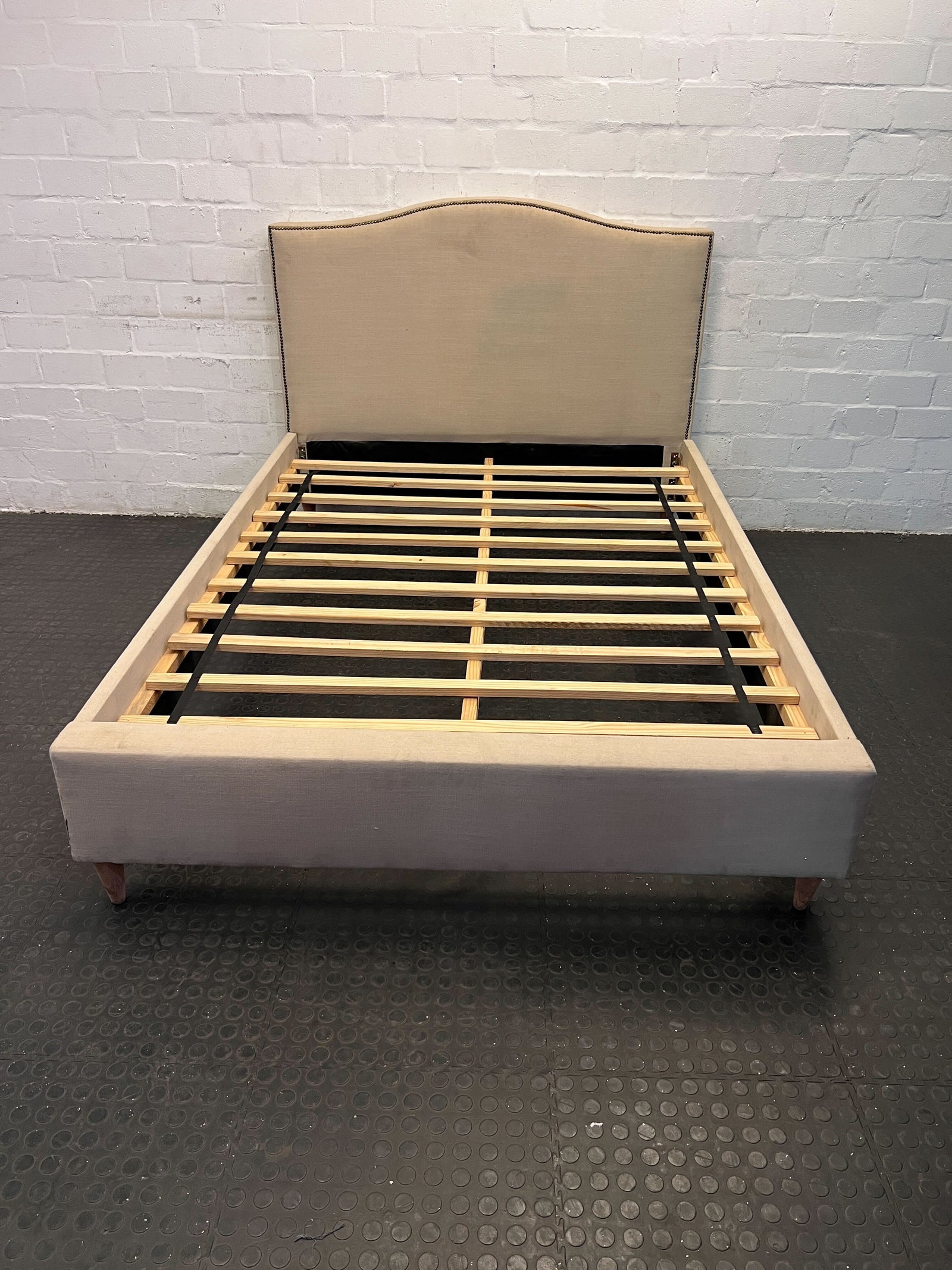 Elegant Beige Upholstered Double Bed Frame with Minor Wear