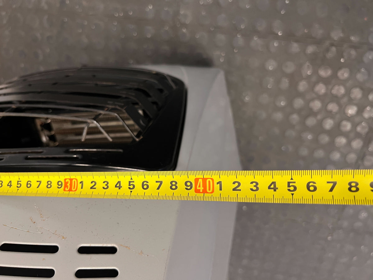 Compact DeLonghi Silver Heater with Minor Scratches - PRICE DROP