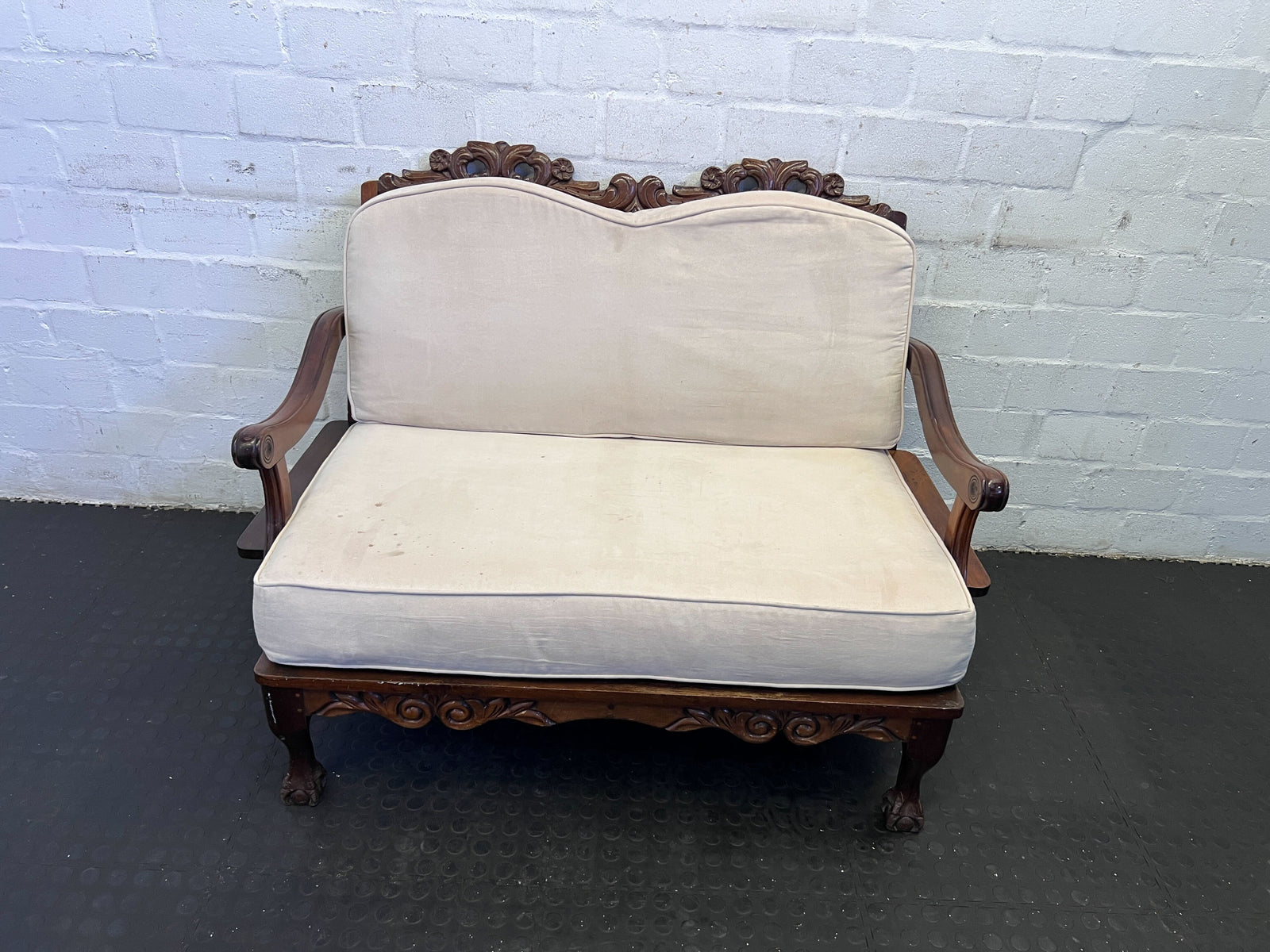 Vintage Cream Upholstered Loveseat with Intricate Wood Carvings