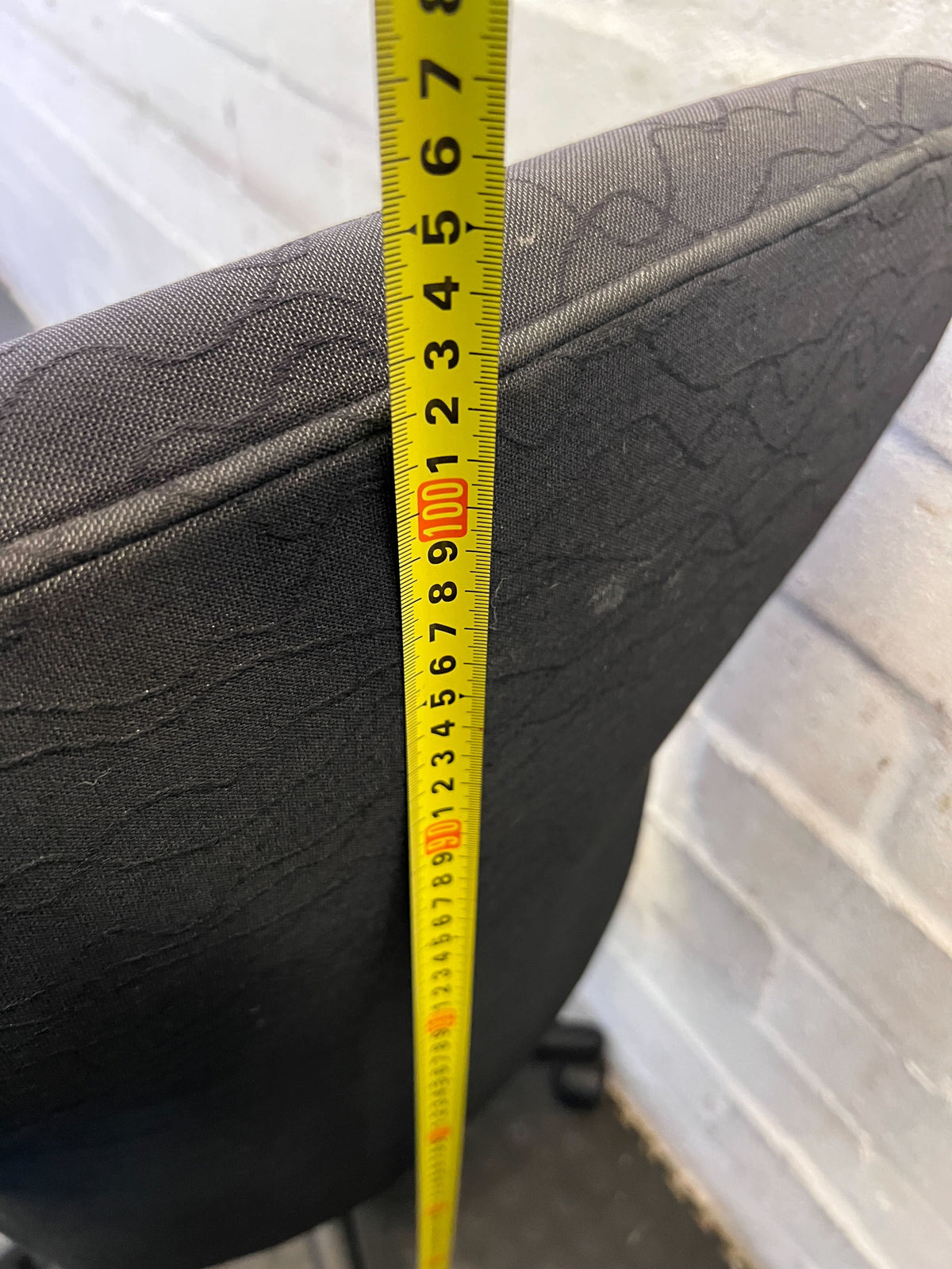 Comfortable Black Fabric Office Chair with Minor Wear