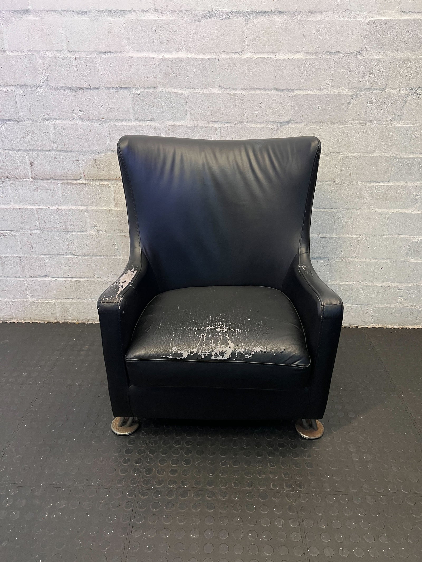 Stylish Black Leather Armchair with Minor Wear