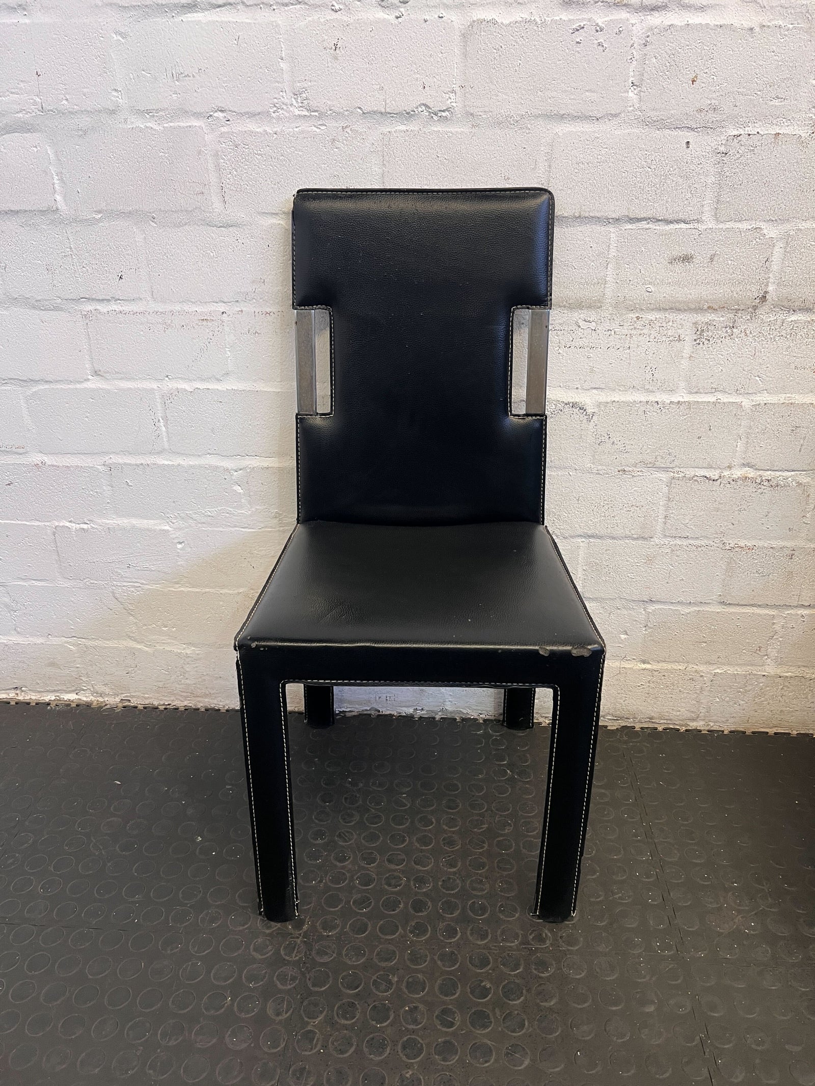Sleek Black Faux Leather Dining Chair with Minor Wear - REDUCED