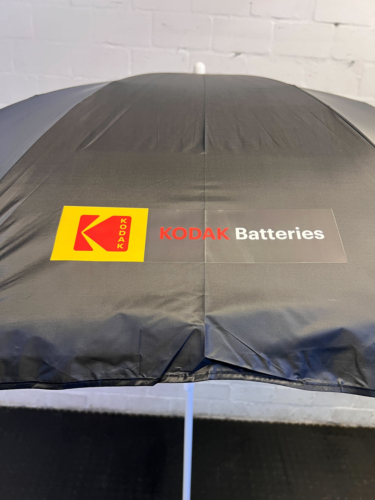 Stylish Black Kodak Batteries Beach Umbrella – Slight Wear
