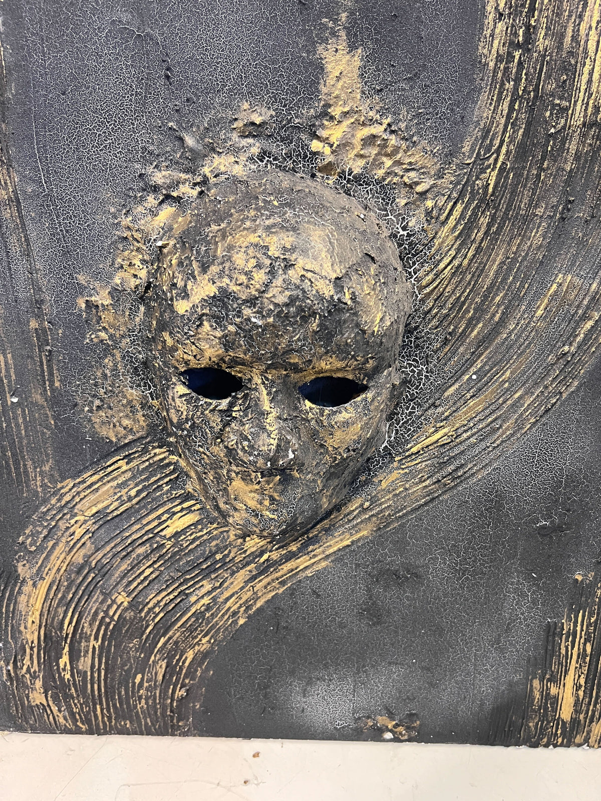 Artistic Black and Gold Wall Sculpture with Unique Design and Texture