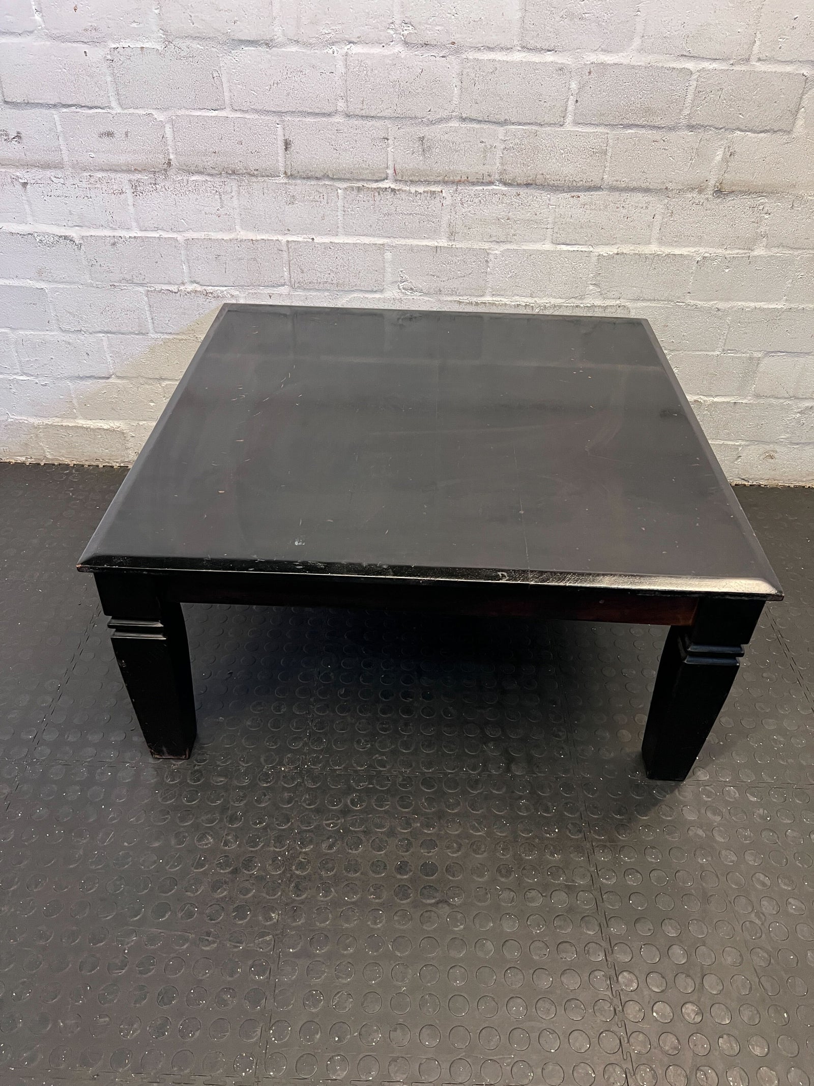 Stylish Black Wooden Coffee Table with Minor Scratches