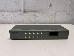 Gray electronic device with 'Clear View' branding on a white surface with a gray brick wall background