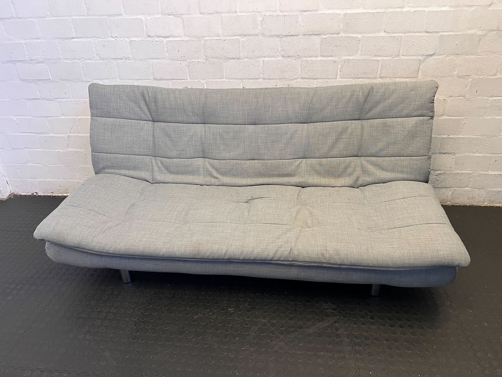 Stylish Grey Fabric Sofa Bed with Minor Wear – Perfect for Small Spaces