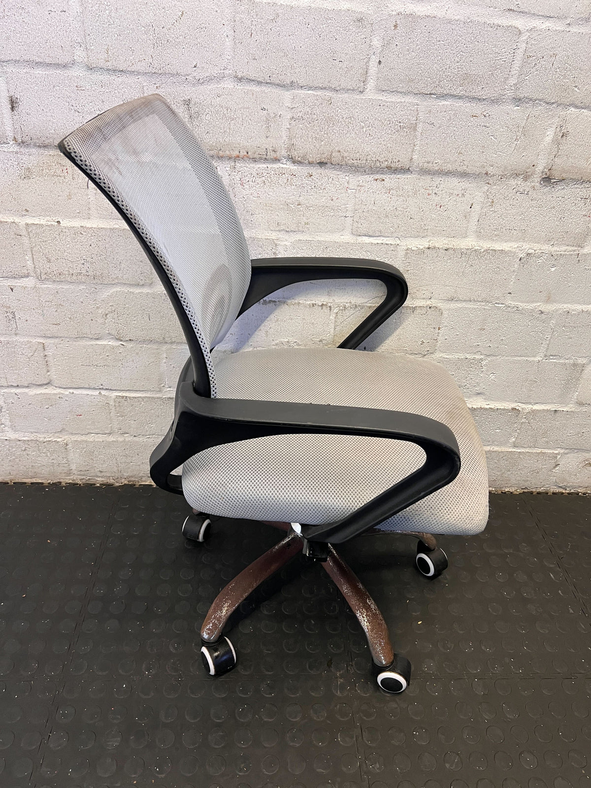 Comfortable Gray Mesh Office Chair with Minor Wear