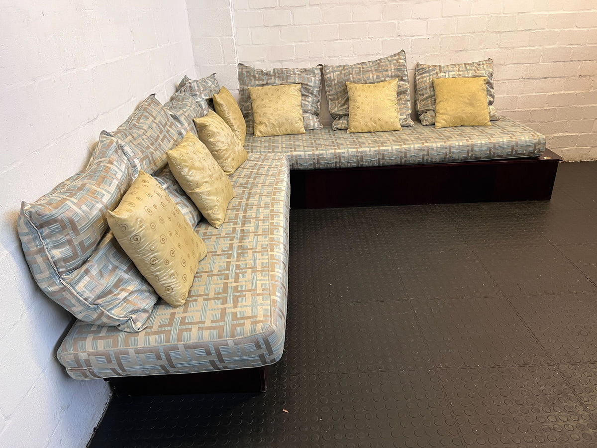 Elegant L-Shape Couch with Cushions in Light Blue and Yellow