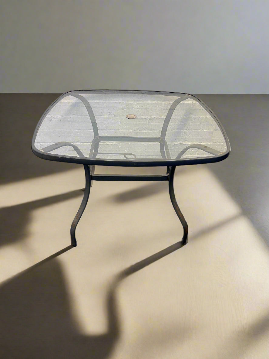 Elegant Glass-Top Dining Table with Metal Frame – Minor Wear - REDUCED
