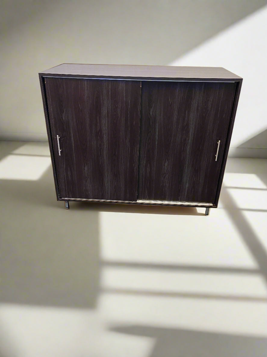 Dark wooden cabinet with two doors on a light background