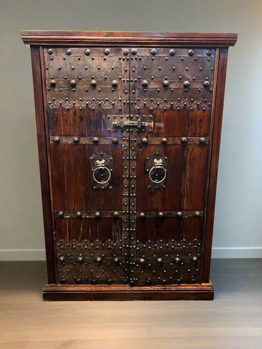 Antique Dark Wood Storage Cabinet with Decorative Metal Accents